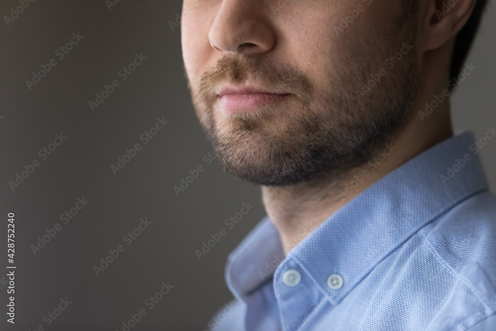 Crop close up of young Caucasian man isolated on gray background look in distance thinking pondering of new opportunities. Determined male make plan decision, motivated for success. Vision concept. Crop close up of young Caucasian man isolated on gray background look in distance thinking pondering of new opportunities. Determined male make plan decision, motivated for success. Vision concept.