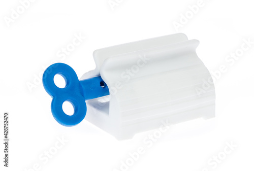 Tableau sur toile Toothpaste squeezer isolated on white background.