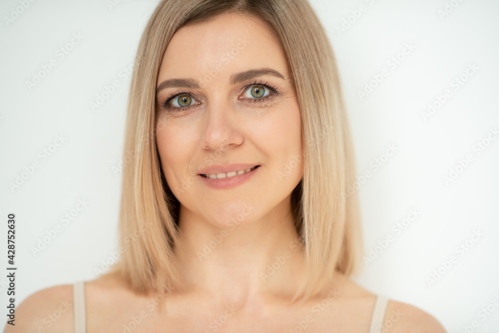 Beautiful calm middle aged woman, natural light. Anti-aging and beauty treatment. Beautiful calm middle aged woman, natural light. Anti-aging and beauty treatment.