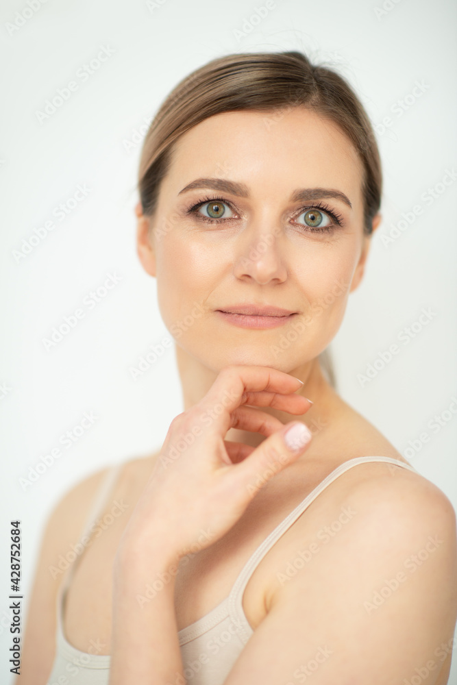 Beautiful calm middle aged woman, natural light. Anti-aging and beauty treatment. Beautiful calm middle aged woman, natural light. Anti-aging and beauty treatment.