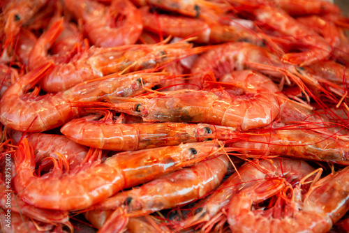 large boiled red prawns sold on outdoor italian market in Sicily