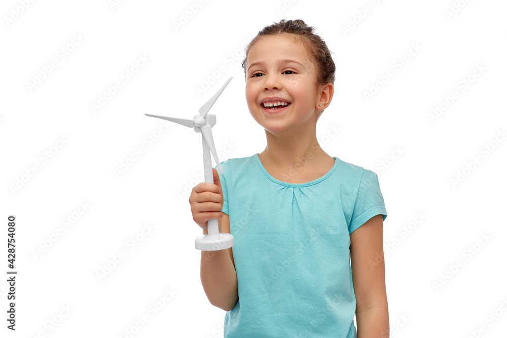 sustainable energy, power and people concept - happy smiling girl with toy wind turbine over white background sustainable energy, power and people concept - happy smiling girl with toy wind turbine over white background