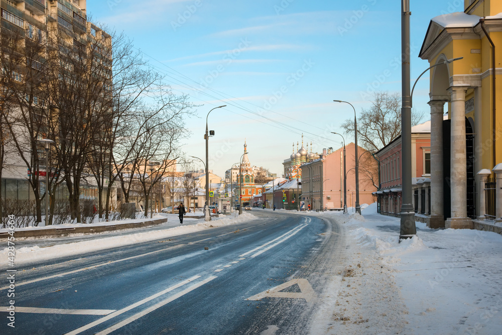 View of Bolshaya Polyanka Street and the Church of Grigory Neokesary on a frosty winter morning after a heavy snowfall. View of Bolshaya Polyanka Street and the Church of Grigory Neokesary on a frosty winter morning after a heavy snowfall.