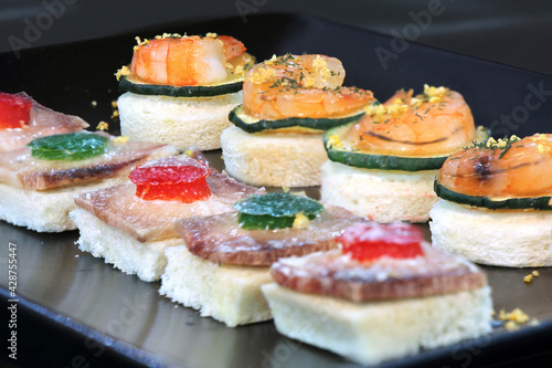 Assorted canape with shrimp and zucchini, homemade party food