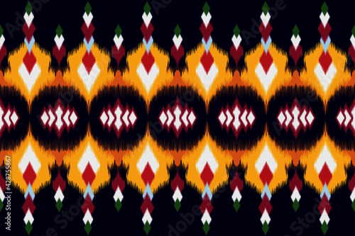 Ikat ethnic Indian seamless pattern design for fabric textile. Carpet ornament mandala chevron wallpaper 
