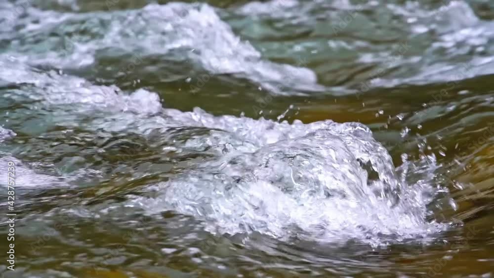 Tracking shot of gurgling water flowing Tracking shot of gurgling water flowing
