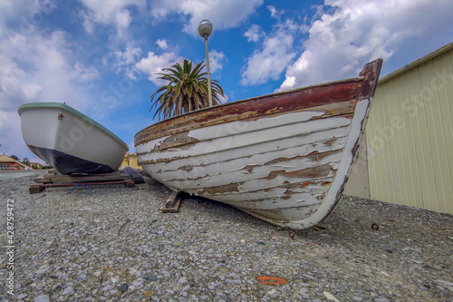 wooden boat by the sea ready for summer season in Varazze liguria Italy