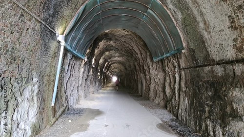 Old railroad abandoned tunnel between Varazze and cogoleto Liguria Italy transformed in walking and bycicle trail photo