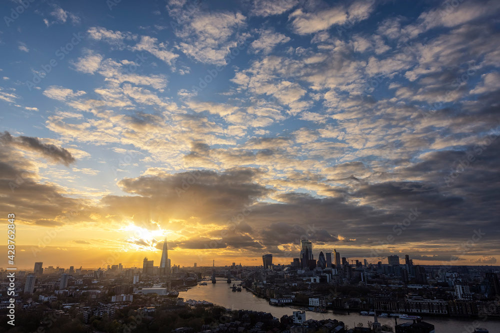 Wide panoramic view over the skyline of London, United Kingdom, during a beautiful sunset