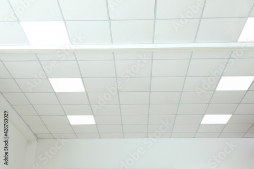 White ceiling in office room. Interior design