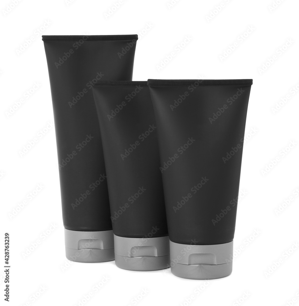 Black tubes with men's cosmetic products on white background