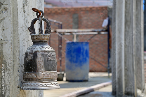 Closeup of Old Bronze Bells in the temple at bangkok, Thailand, selective focus.