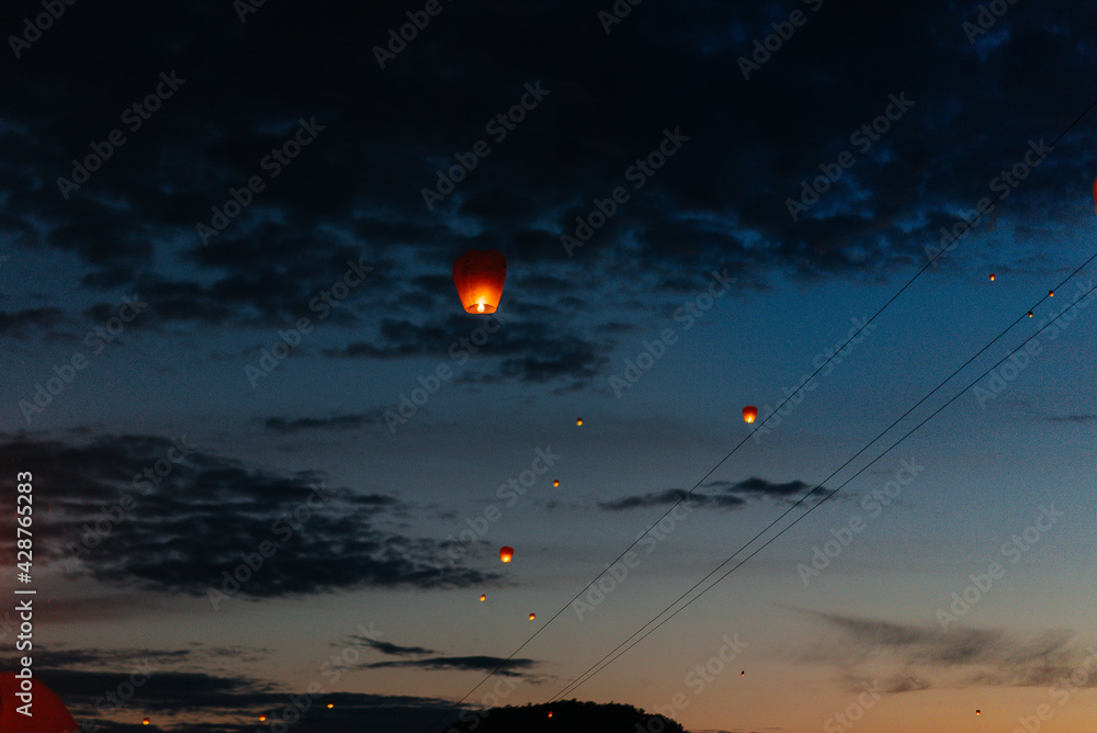 In the evening, at sunset, people with their relatives and friends launch traditional lanterns. Tradition and travel In the evening, at sunset, people with their relatives and friends launch traditional lanterns. Tradition and travel