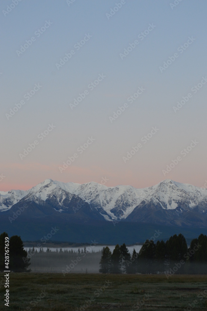 Wall of Actru in the early morning in a foggy robe, Altai Wall of Actru in the early morning in a foggy robe, Altai