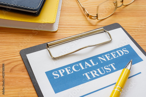 Special needs trust application with clipboard and notepad.