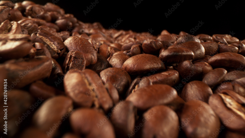 Fototapeta premium Pile of fresh roasted coffee beans with