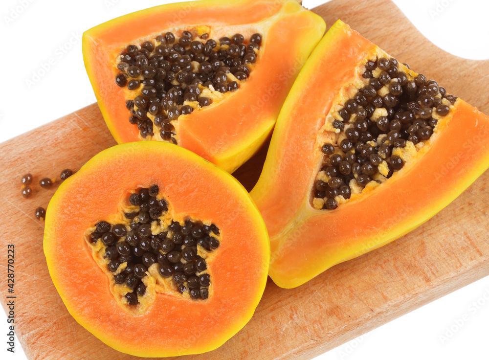 Half cut of ripe papaya with seeds isolated on white background. Half cut of ripe papaya with seeds isolated on white background.