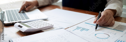 Fotografie Financial inspector calculating a numbers in office room..