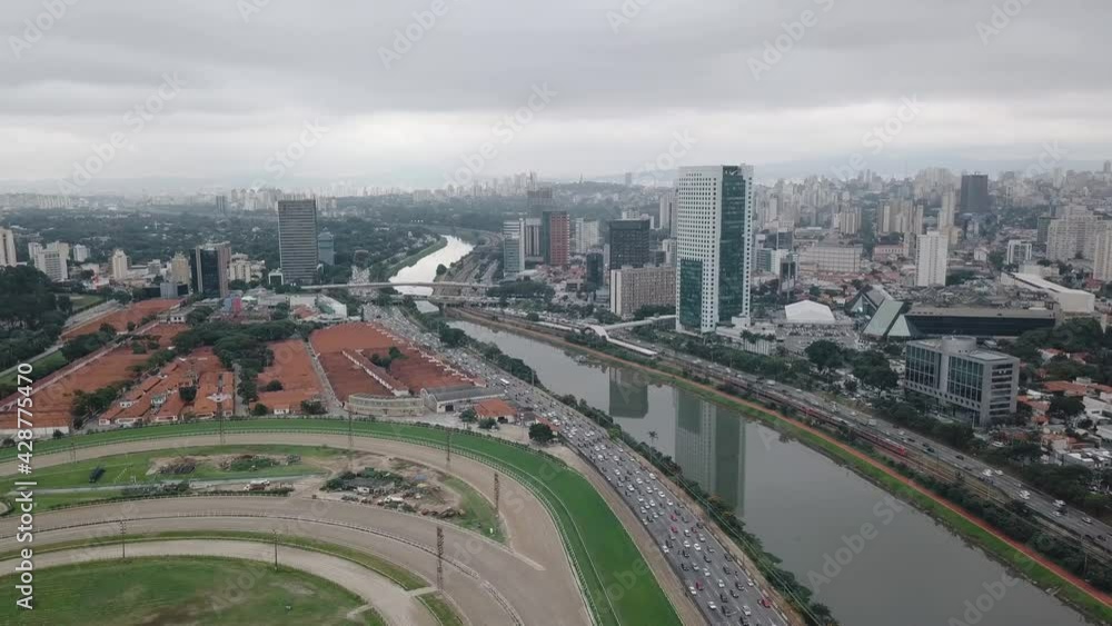 Drone aerial view City of Sao Paulo, district Chacara Itaim, river Pinheiros, av das na es unidas, shooting with a drone 4k 24 fps, river, car traffic, buildings cityscape and Sao Paulo city skyline. Drone aerial view City of Sao Paulo, district Chacara Itaim, river Pinheiros, av das na es unidas, shooting with a drone 4k 24 fps, river, car traffic, buildings cityscape and Sao Paulo city skyline.