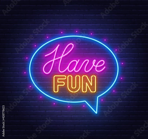 Have fun neon sign in the speech bubble on brick wall background.
