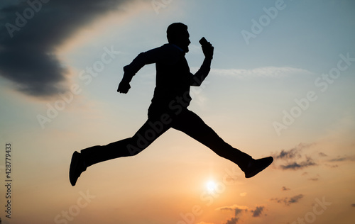Wallpaper Mural total freedom. personal achievement goal. man silhouette jump on sky background. confident businessman running. daily motivation. enjoying life and nature. business success. freedom Torontodigital.ca
