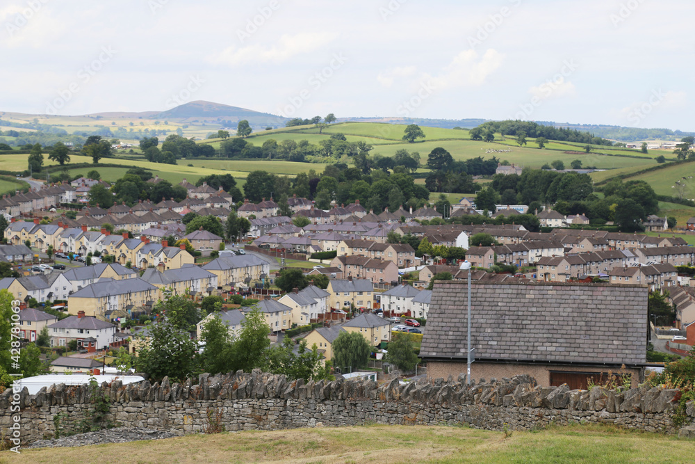 A view over the houses in Denbigh, Wales, looking towards the distant green hills.