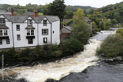 A view down the Dee river from the bridge in the centre of Llangollen, Denbighshire, Wales, UK. photo