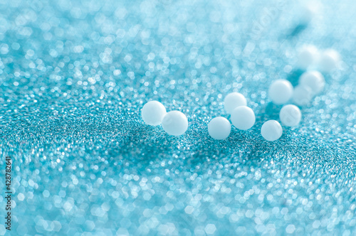 homeopatic globules on blue background