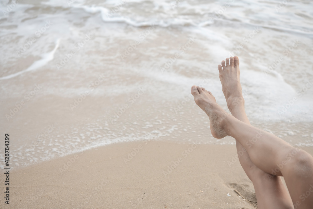 legs and barefoot feet on the beach legs and barefoot feet on the beach