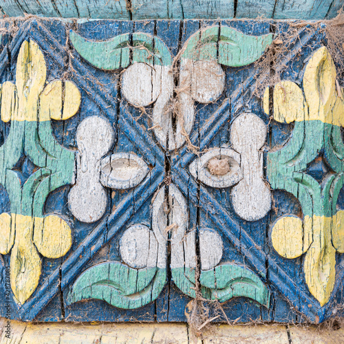 Traditional painting on the wooden pillar of Apak Khoja Mausoleum in Kashgar, Xinjiang, China photo