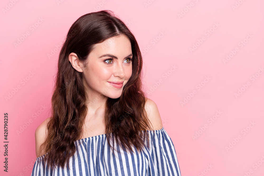 Photo of adorable pretty young woman dressed striped outfit smiling looking empty space isolated pink color background Photo of adorable pretty young woman dressed striped outfit smiling looking empty space isolated pink color background