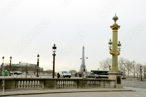 Lamp posts on a corner street leading to Tour de Eiffel in Paris, France on a quiet day