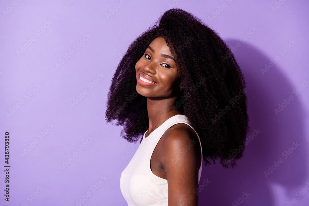 Profile photo of friendly gorgeous dark skin person toothy smile look camera isolated on violet color background Profile photo of friendly gorgeous dark skin person toothy smile look camera isolated on violet color background