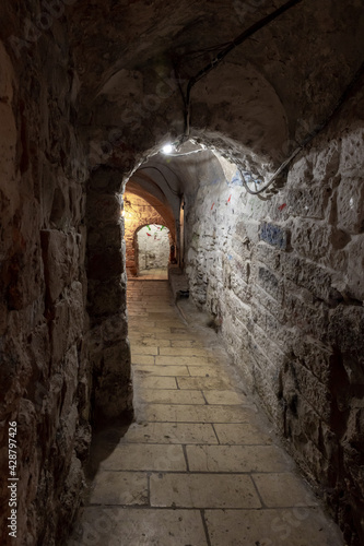 Tunnel  passage under residential buildings in the Muslim quarter near the exit from the Temple Mount - Chain Gate  in the old city of Jerusalem  in Israel