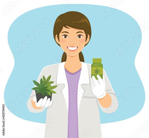 Cannabis in medical use. Female scientist holding marijuana plant and medicine made of hemp.