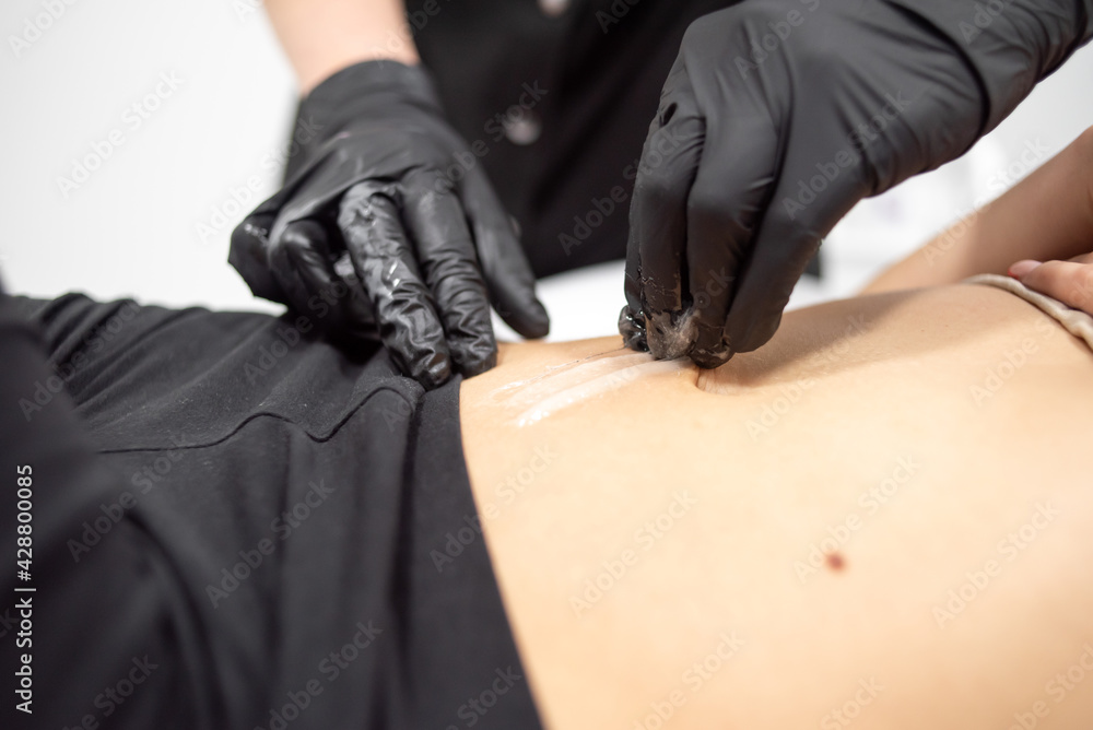 Epilations procedure for woman in beauty salon Epilations procedure for woman in beauty salon