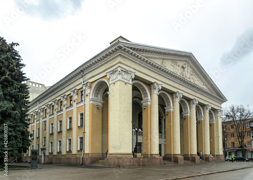Poltava, Ukraine - April 14, 2021: Majestic antique columns of the ancient facade of the building of the Gogol Drama Theater in the city of Poltava, Ukraine. Historical and cultural center