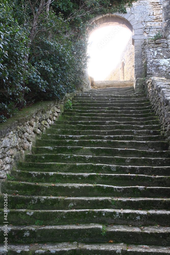 A view from the bottom of an old stone staircase in the village of Bonnieux (Vaucluse, Luberon, France)