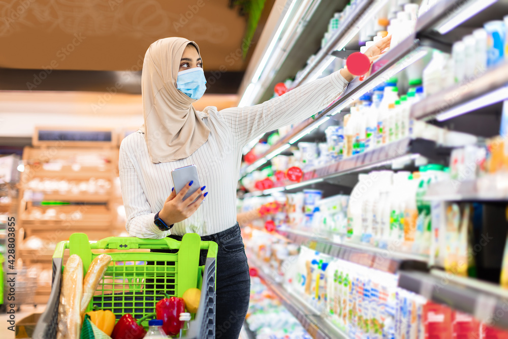 Muslim Lady Using Phone Buying Food On Shopping In Supermarket
