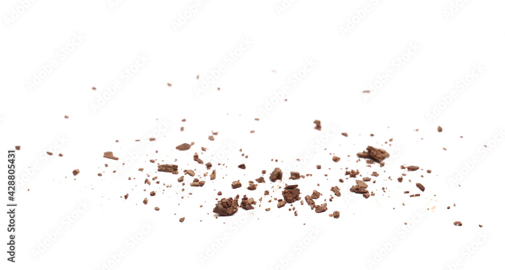 Chocolate crumbs pile isolated on white background