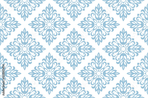 Wallpaper in the style of Baroque. Seamless vector background. White and blue floral ornament. Graphic pattern for fabric, wallpaper, packaging. Ornate Damask flower ornament