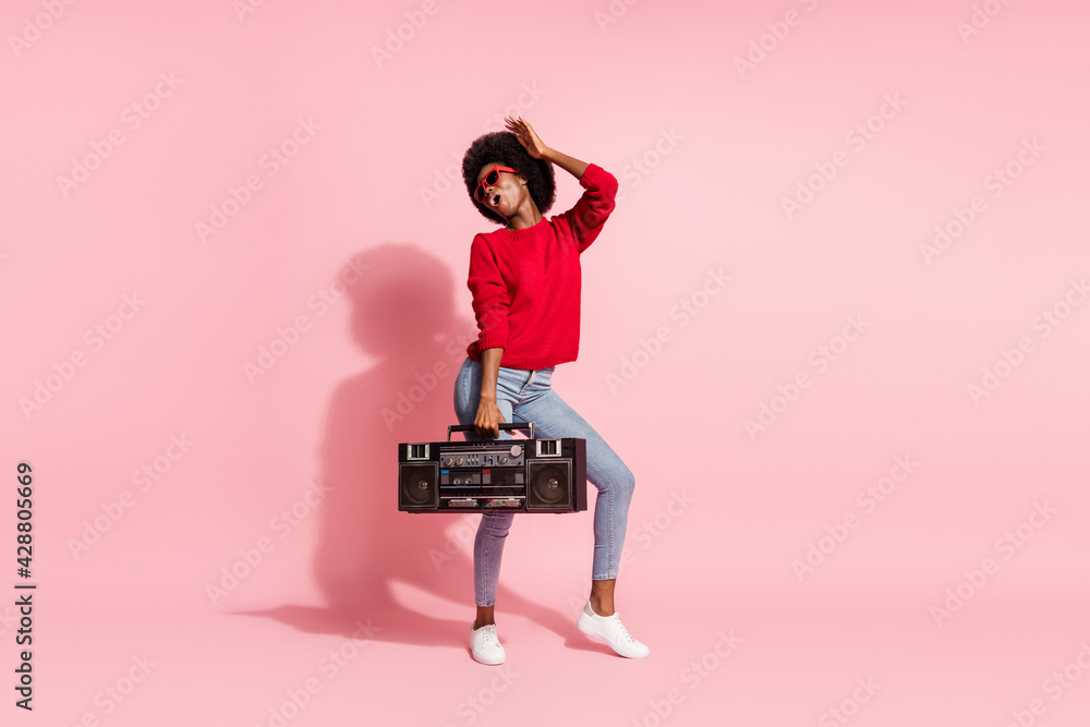 Fototapeta premium Full body photo of excited funny dark skin person hold boombox partying isolated on pink color background