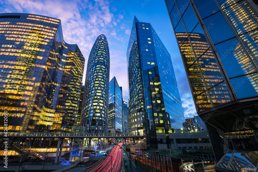 Obraz premium La Defense, the business district of Paris during the blue hour. D2 tower, Courbevoie, Puteaux, Nanterre, Paris, France