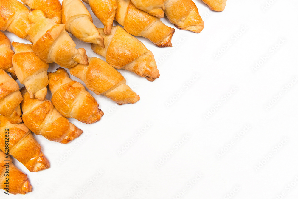 Fresh homemade cakes. Buns. Croissants isolated on white background, culinary composition, copy space and mock up Fresh homemade cakes. Buns. Croissants isolated on white background, culinary composition, copy space and mock up