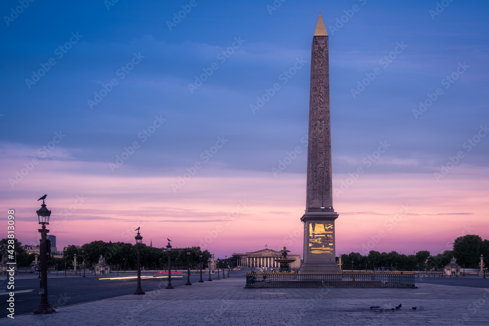 The Place de la Concorde during the blue hour. The National Assembly building is visible in the background. Paris, France