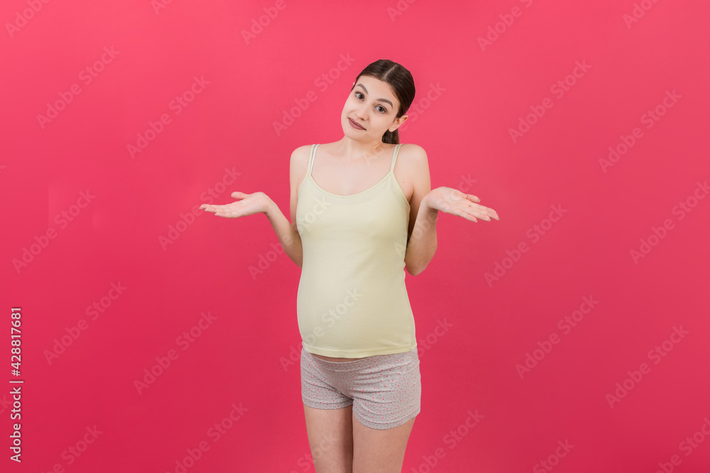 happy surprised pregnant woman posing isolated over colored background. copy space happy surprised pregnant woman posing isolated over colored background. copy space