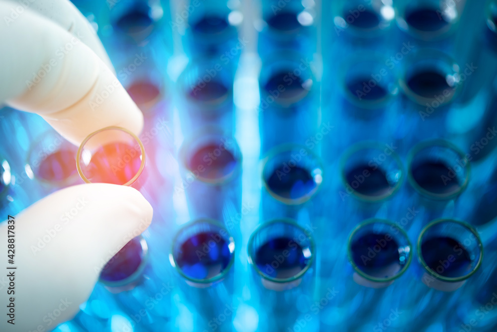 scientist hand pick up test tube from rack scientist hand pick up test tube from rack