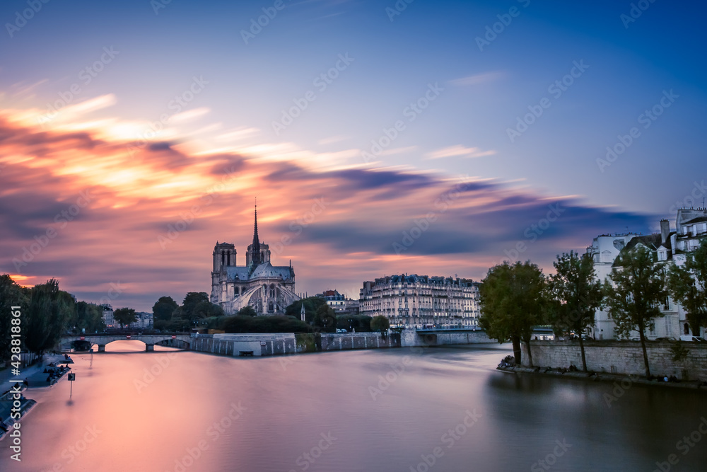 Notre Dame de Paris and the Seine River at sunset. Paris, France