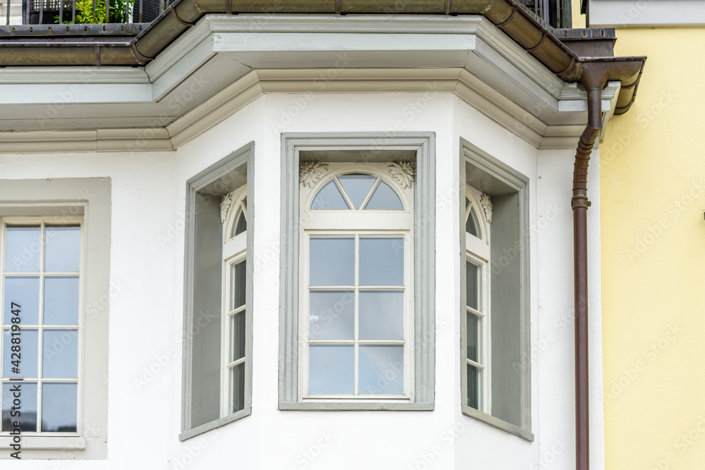 Fragment of an apartment building with nice window.