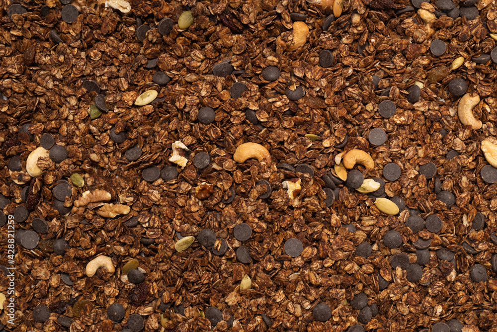 Chocolate granola cereal with nuts background. Chocolate granola cereal with nuts background.